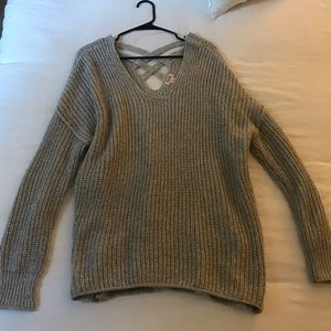 Gray sweater- crossed back. Small snag on back